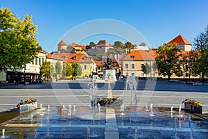 Main Dobo square in Eger Hungary with fountain statue and the castle fortress