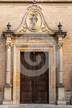 Main door of the church in the town of Porreres photo