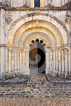 Main door of Petit Palais et Cornemp romanesque church Gironde F photo