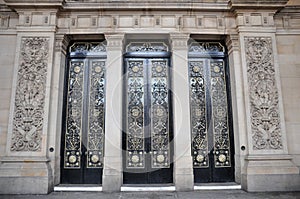 The main doors of leeds town hall with ornate columns and carving