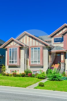 Main entrance of big family house with concrete door steps in front