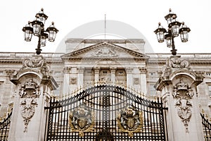 The main entrance gate of Buckingham Palace. The front of Buckingham Palace in the afternoon.