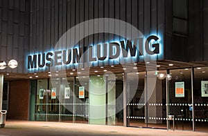 main entrance museum Ludwig in Cologne, illuminated sign, closed doors