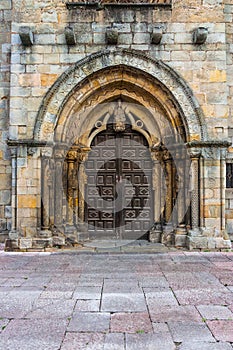 Main entrance of the romanesue church of Santa Maria de la Oliva in Villaviciosa Spain photo