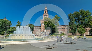 Main entrance to the Sforza Castle - Castello Sforzesco and fountain in front of it timelapse hyperlapse, Milan, Italy