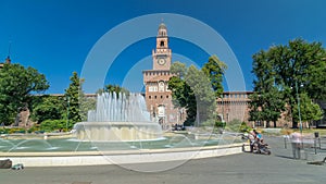 Main entrance to the Sforza Castle - Castello Sforzesco and fountain in front of it timelapse hyperlapse, Milan, Italy photo