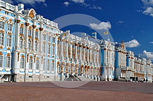 Main facade of the historic palace in the Baroque style. Blue, white and gold gamma. Summer sunny day