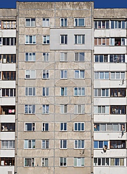 Main facade of multi-apartment large-panel residential building soviet architecture houses. photo