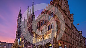 Main facade of the New Town Hall building at the northern part of Marienplatz day to night timelapse in Munich, Germany.