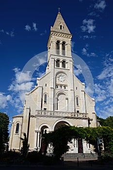 Main facade of the Notre-Dame-du-Rosaire Church, in Saint-Ouen, France . photo