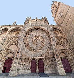 Main facade of Salamanca New Cathedral with red doors, Community of Castile and LeÃ³n, Spain.  Declared a UNESCO World Heritage