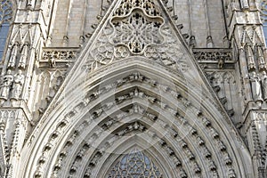 Main gate, Facade of the Cathedral of Barcelona located in the o