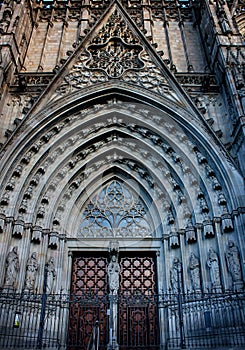 Main gate, facade and entrance of the Gothic Barcelona Cathedral, The Cathedral of the Holy Cross and Saint Eulalia.