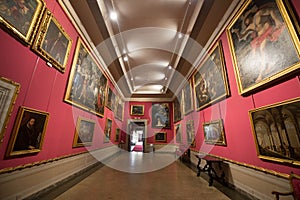 Main halls with traditional paintings in The Museo Nazionale di Palazzo Mansi in Lucca, Italy.