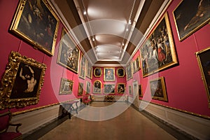 Main halls with traditional paintings in The Museo Nazionale di Palazzo Mansi in Lucca, Italy.