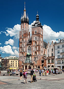 Main market and Basilica of Saint Mary Church of Our Lady Assumed into Heaven also known as Saint Mary`s Church. Cracow in Poland