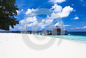 Main pier and white sand beach on Pulau Sipadan island near Borneo photo