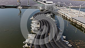 The main power cable installed with flexible cable conduit to Floating Solar PV System. Floating Photovoltaic Solar Plants. The ma