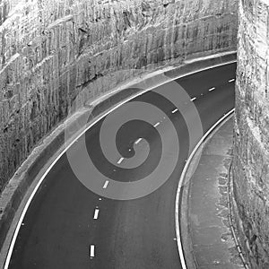 Expressway winding into tunnel