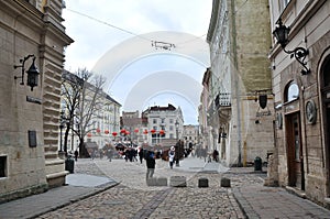 Main square of Lviv, street, passers, medieval architecture