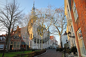 The main Square Markt with traditional medieval houses and the Stadhuis town hall with its impressive clock tower in Veere