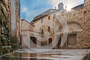 Main Square in the medieval small village Pals in Catalonia, Spain. Mediterranean cities for tourism with cobbled streets