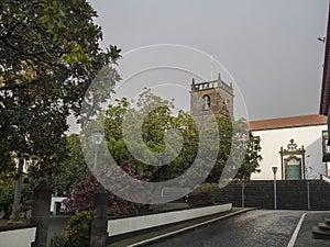 Main square with park and church Igreja de Sao Miguel Arcanjo in the center of Vila Franca do Campo town, located on Sao photo