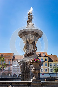 Main square with Samson fighting the lion fountain sculpture and bell tower in Ceske Budejovice. Czech Republic