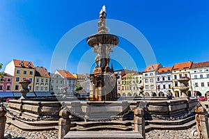 Main square with Samson fighting the lion fountain sculpture and bell tower in Ceske Budejovice. Czech Republic