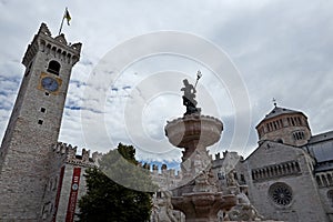 The main square in Trento, Piazza Duomo, with clock tower and the Fountain of Neptune.