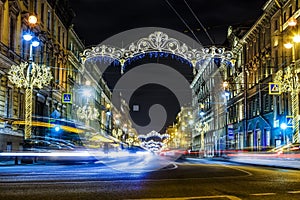 Main street of the city of St. Petersburg Nevsky prospect, decorated with new year neon illumination with traces of car