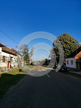 The main street of Holod, a village in north-western Romania, in the afternoon