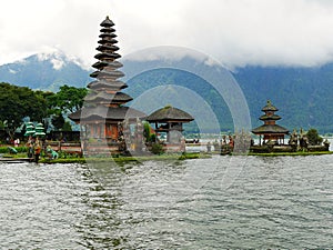 Main temple on the water in Bali, Pura Oolong Danu Bratan, Lake Bratan, beautiful temple, water around the temple, statues in Bali