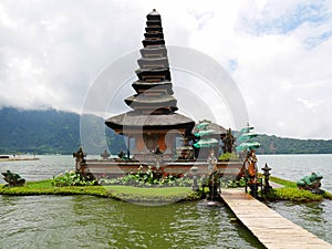 Main temple on the water in Bali, Pura Oolong Danu Bratan, Lake Bratan, beautiful temple, water around the temple, statues in Bali