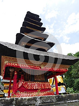 Main temple on the water in Bali, Pura Oolong Danu Bratan, Lake Bratan, beautiful temple, water around the temple, statues in Bali