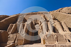 The main view of an Entrance to the Great Temple at Abu Simbel with Ancient Colossal statues of Ramesses II