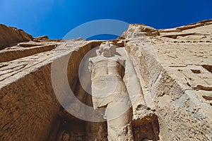 The main view of an Entrance to the Great Temple at Abu Simbel with Ancient Colossal statues of Ramesses II