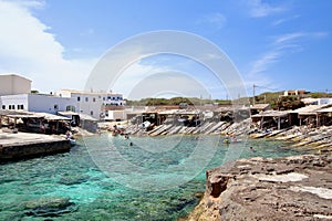 Main view of Es Calo fishermen bay, with white village houses on background, Formentera, Balearic Islands, Spain