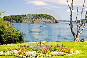 Maine coastline and sailboat