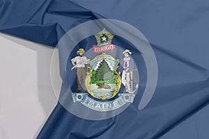 Maine fabric flag crepe and crease with white space. Maine coat of arms defacing blue field