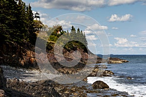 Maine Lighthouse Over Cliffs by Seacoast at Low Tide