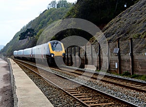 Mainline train leaving Teignmouth station heading towards Exeter