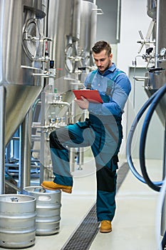 Maintaince worker wrting on clipboard