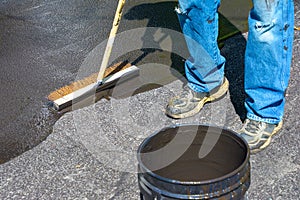 Maintaining an asphalt driveway with blacktop sealer