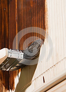 Maintaining of wooden surfaces with protective paint