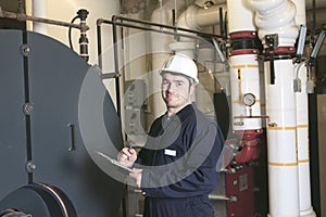 Maintenance engineer checking technical data of