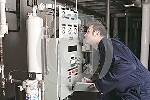 Maintenance engineer checking technical data of