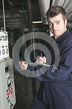 Maintenance engineer checking technical data of