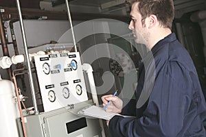 Maintenance engineer checking technical data of