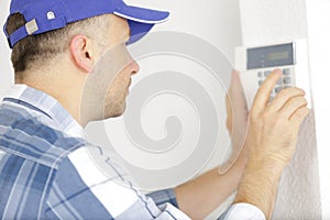 maintenance engineer checking technical data heating system